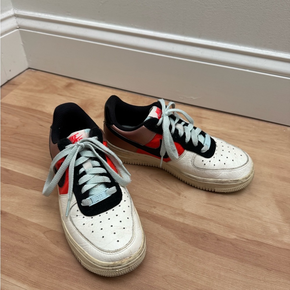 Nike Sneakers with orange and black design.